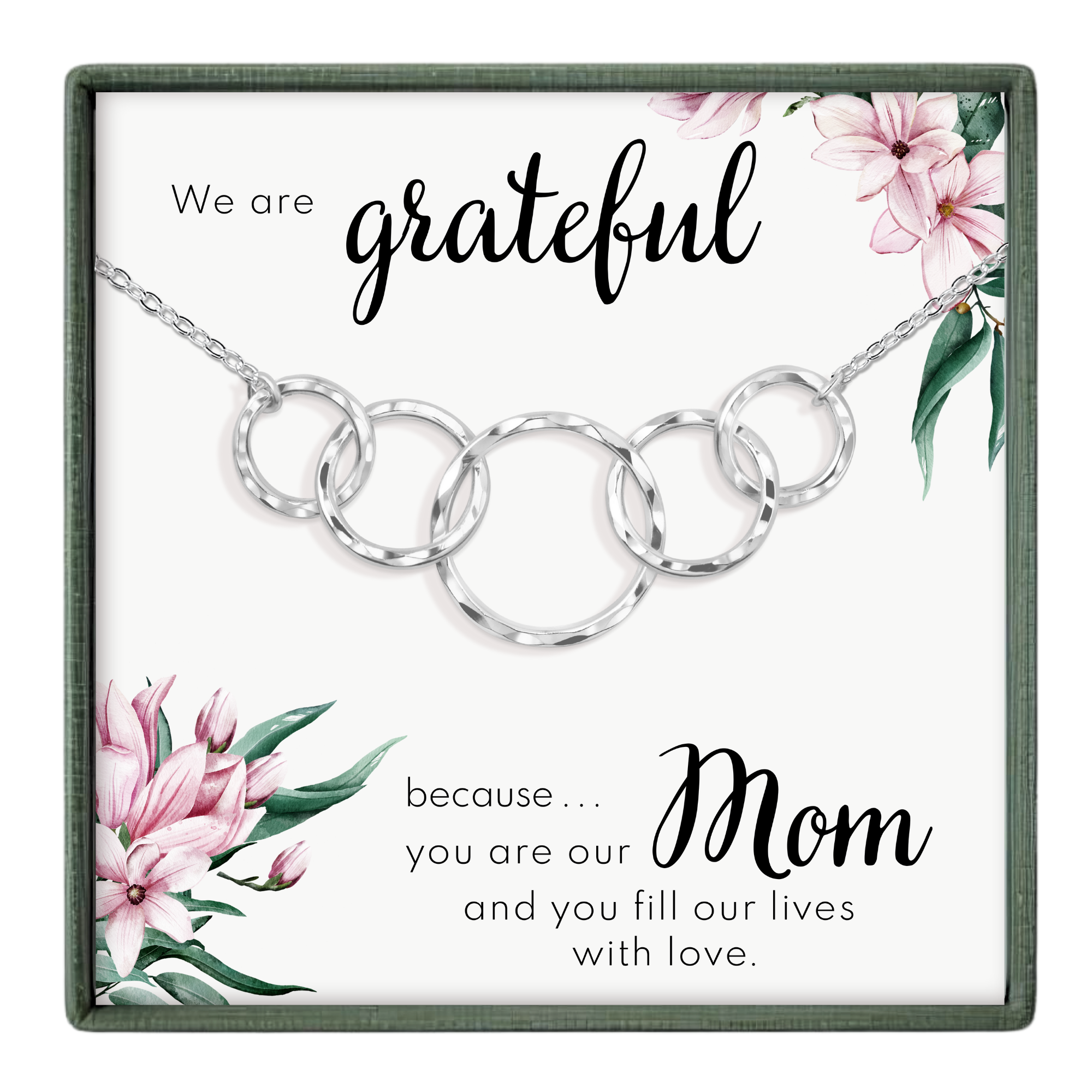 The image is a necklace with a pendant that says "We are grateful because... Mom" and features a floral design.