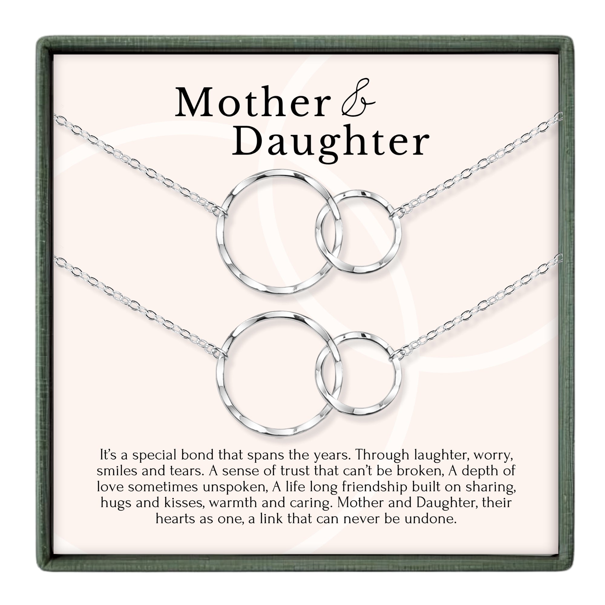 a necklace with two circular pendants, each connected to the other by a chain. The necklace is described as a special bond that spans the years, symbolizing the enduring love and trust between a mother and daughter.