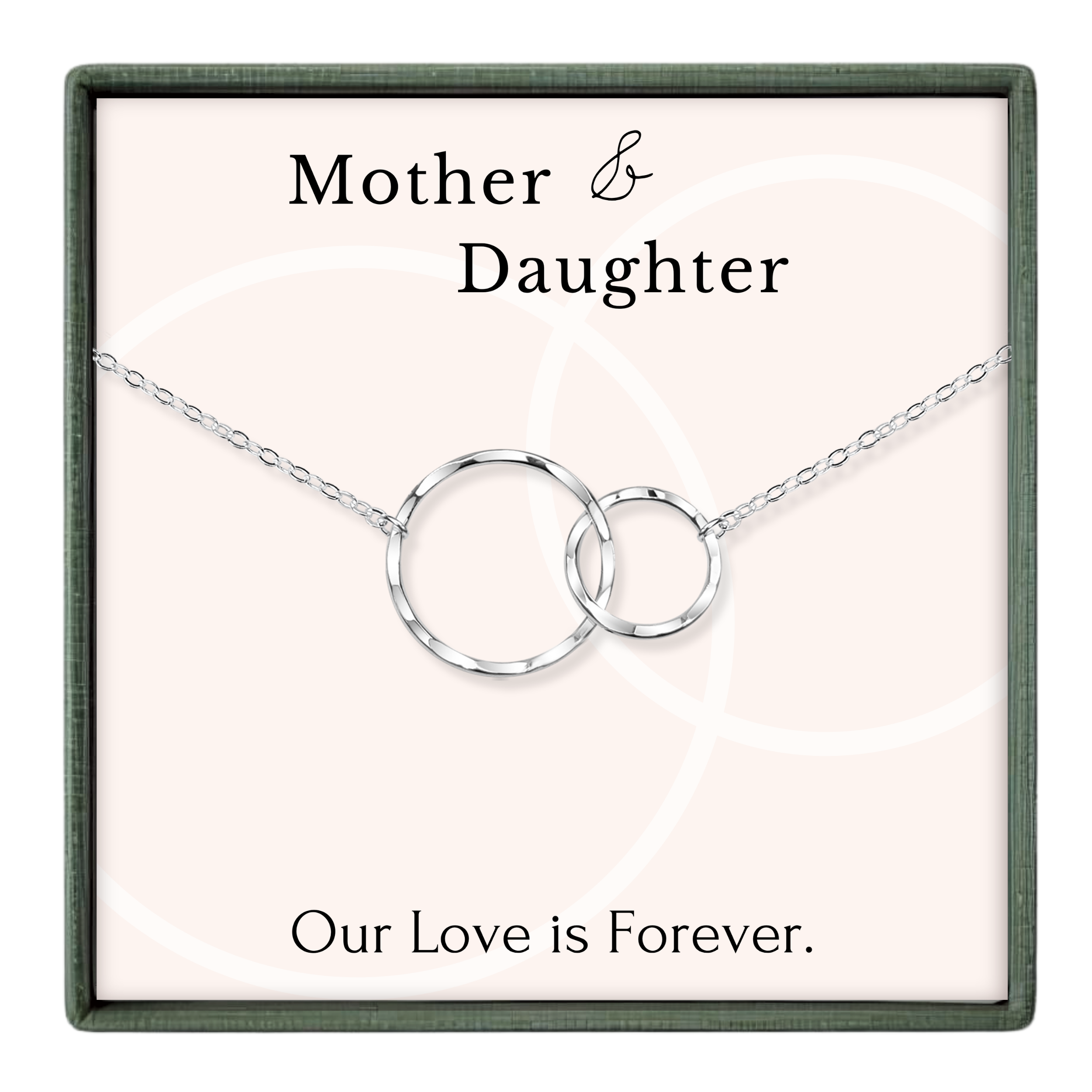 a necklace with two circular pendants, and it is presented in a square frame with a pink background.