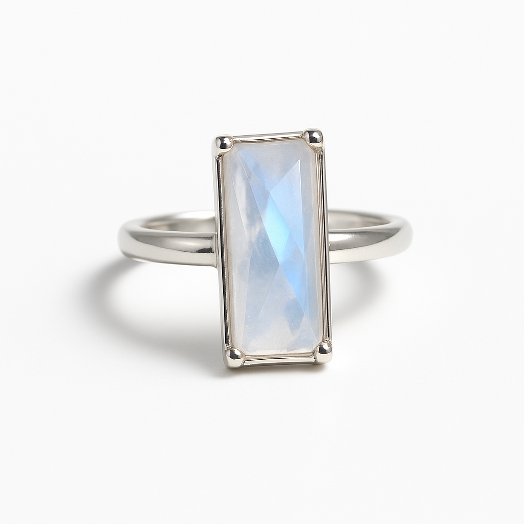 Silver ring with a rectangular moonstone on a white background