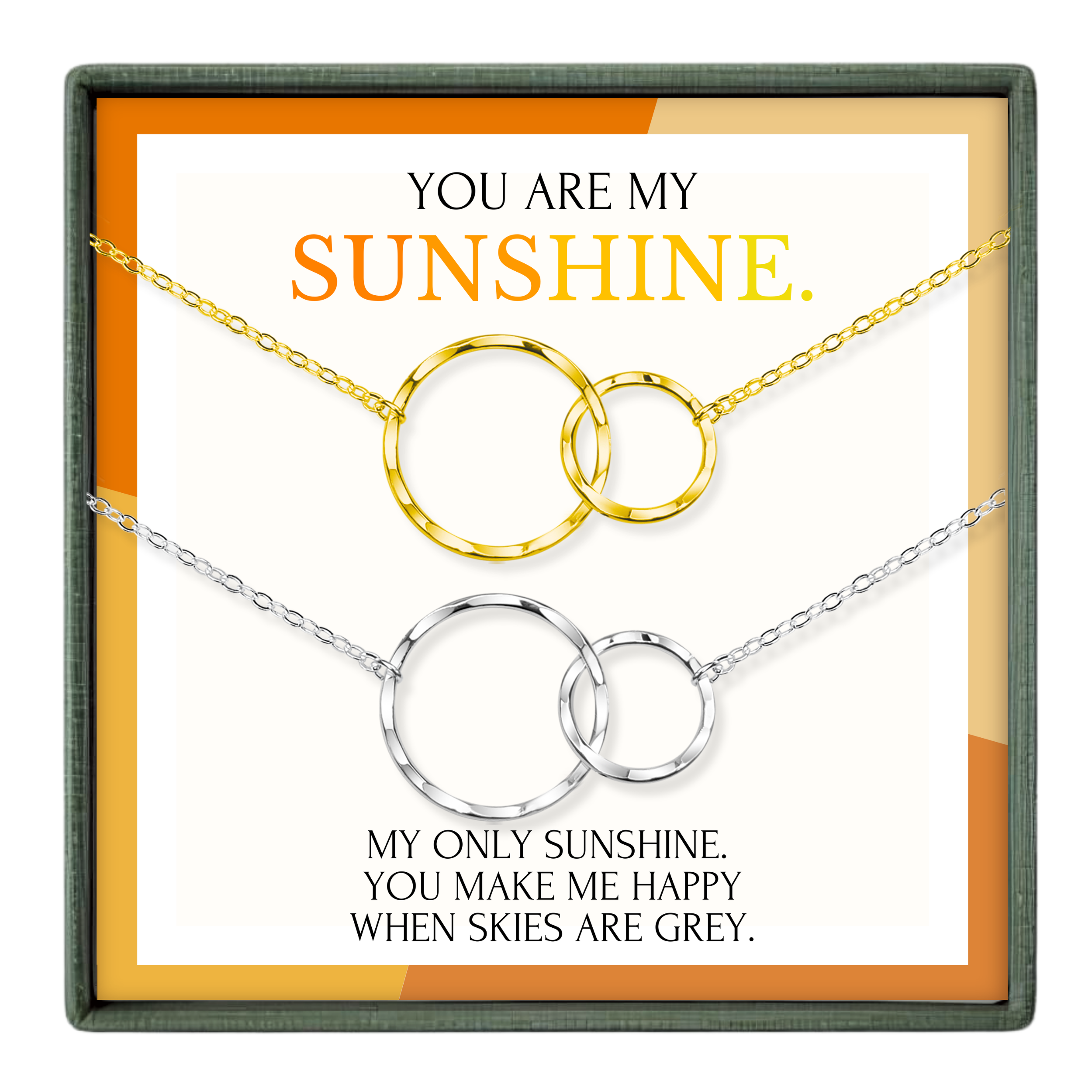 The image is a necklace set with two circular pendants, each with a chain. The text above the necklace reads "YOU ARE MY SUNSHINE." Below the necklace, there is a message that says "MY ONLY SUNSHINE, YOU MAKE ME HAPPY WHEN SKIES ARE GRAY."