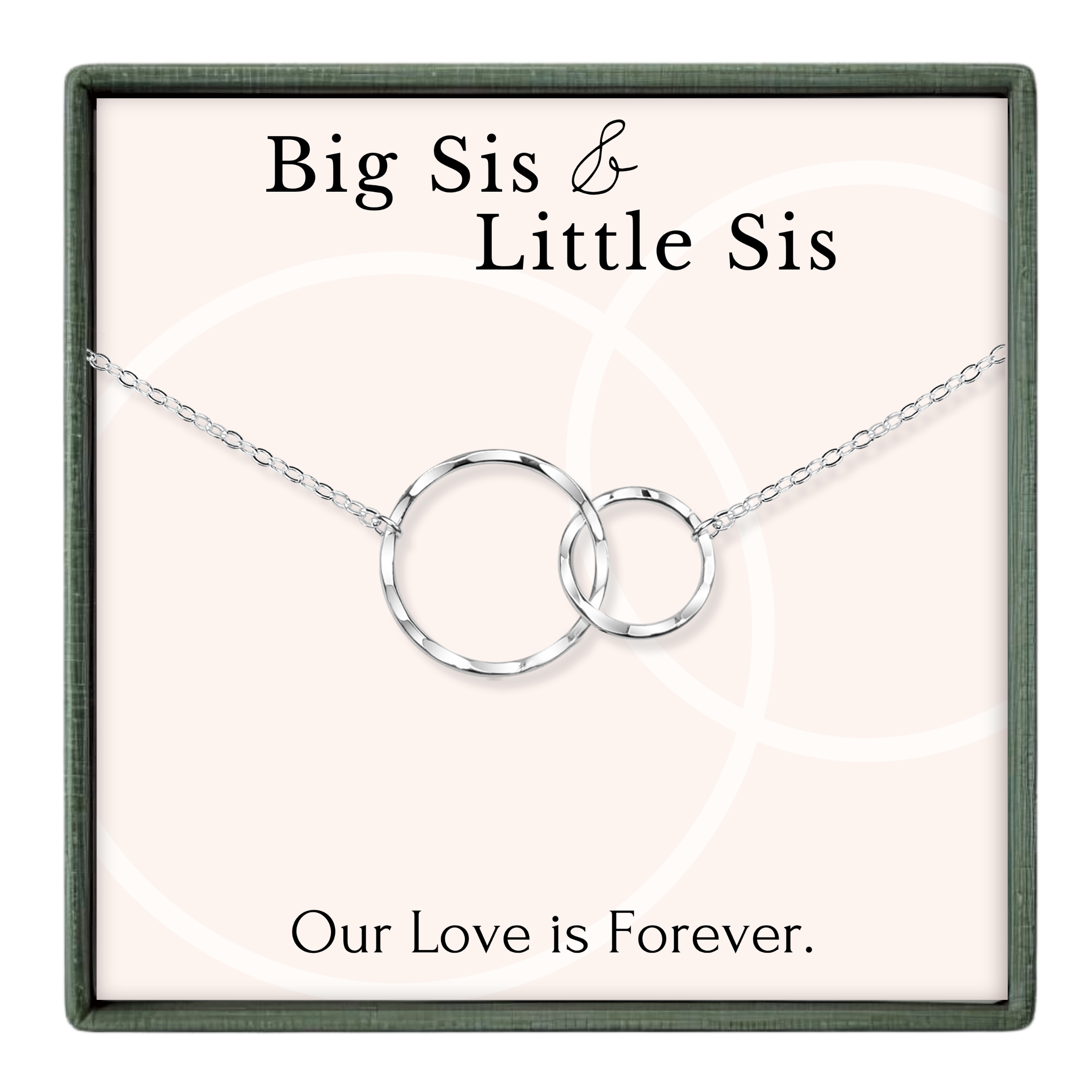 a necklace with two interlocking silver rings, accompanied by the text "Big Sis & Little Sis" and "Our Love is Forever."