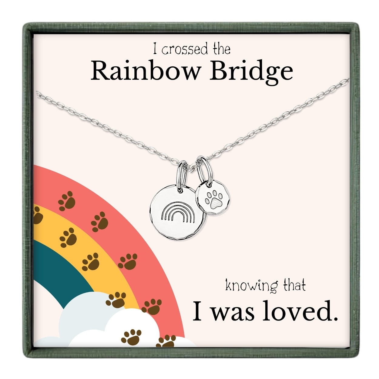 The image is a necklace with a charm that says "I crossed the Rainbow Bridge" and a charm with a paw print, accompanied by the text "knowing that I was loved."