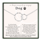 a heartfelt message about a dog, accompanied by a necklace with two interlocking rings. The message expresses love and memories shared between the dog and its owner, and it concludes with a message of hope for the future.