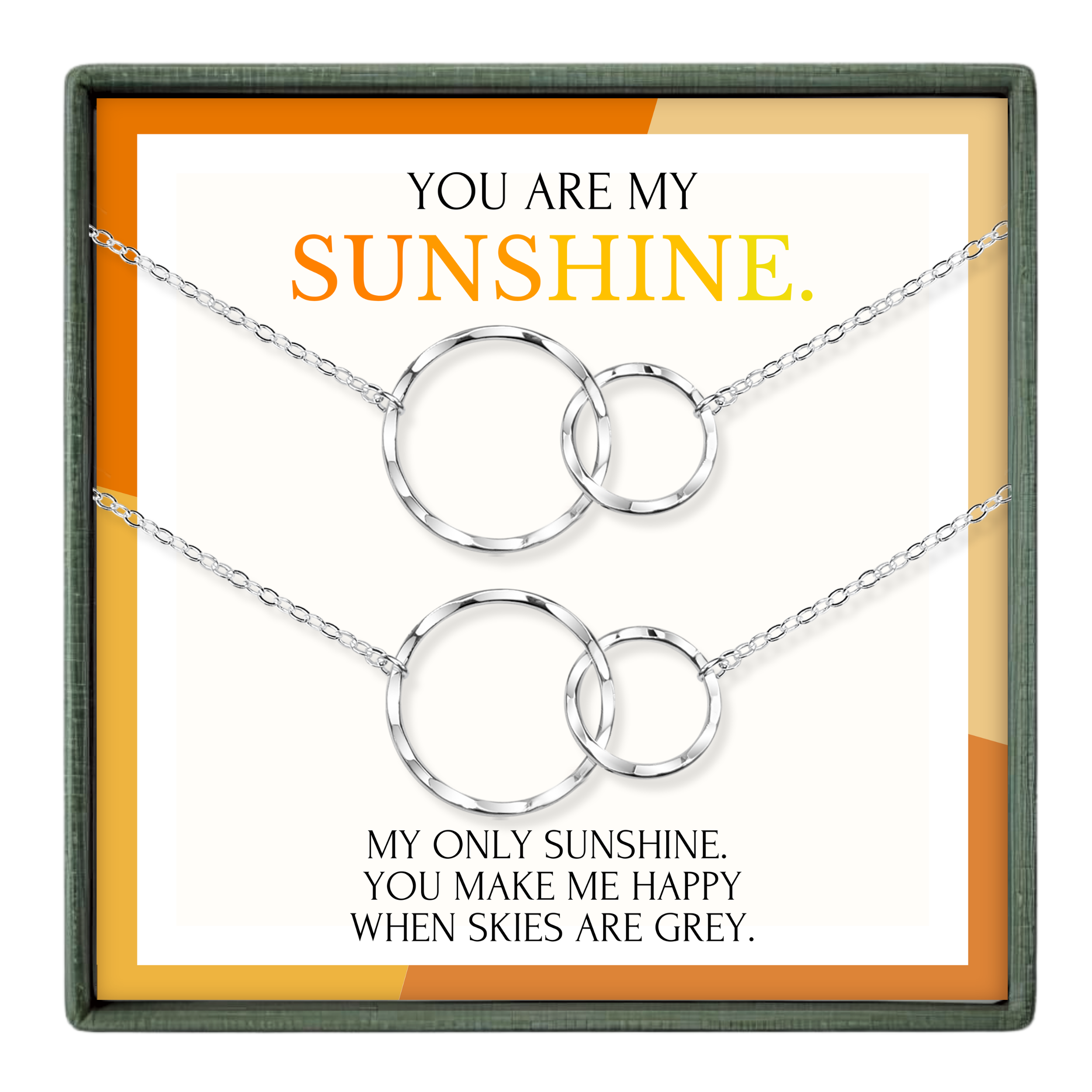 The image is a necklace set with two silver circular pendants, accompanied by a message that reads "You are my sunshine. My only sunshine, you make me happy when skies are grey."