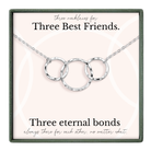 a necklace with three circular rings, each ring connected to the other, forming a chain. The necklace is presented in a box with a label that reads "Three necklaces for Three Best Friends."