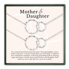 a necklace with two circular pendants, each connected to the other by a chain. The necklace is described as a special bond that spans the years, symbolizing the enduring love and trust between a mother and daughter.