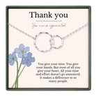 A necklace with two interlocking silver rings, and a bouquet of blue flowers. The text on the necklace reads "Thank you" and "You are so appreciated." The text below the necklace reads "You give your time. You give your hands. But most of all you give your heart. All your time and effort doesn't go unnoticed. It makes a difference to so many people."