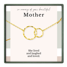 The image is a memorial box for a mother, featuring a necklace with two interlocking rings and a heartfelt message that reads "In memory of your beautiful Mother. She lived and laughed and loved."