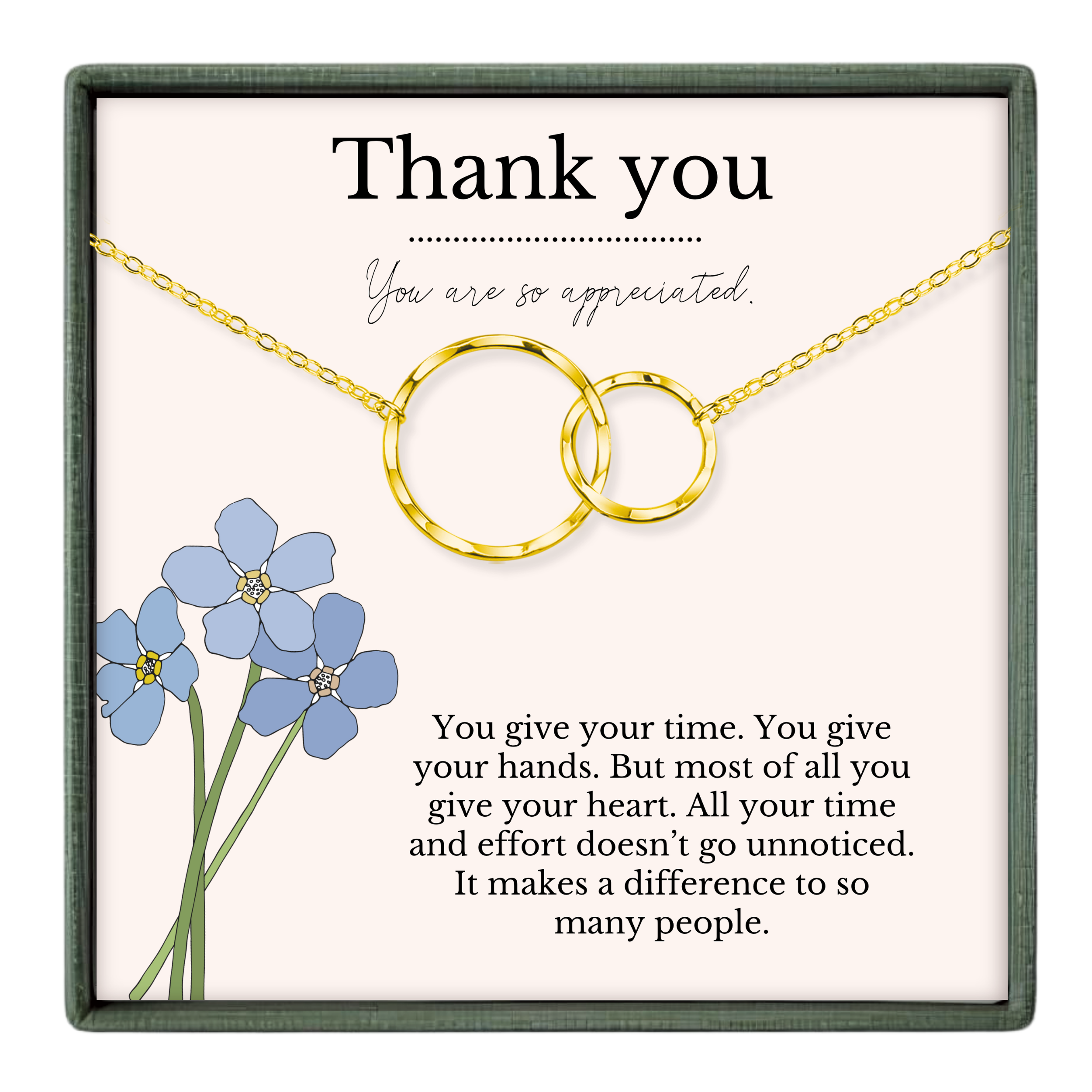The image is a gift box containing a necklace with two interlocking rings, a bouquet of blue flowers, and a message expressing gratitude.