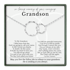 a heartfelt tribute to a grandfather, expressing love and memories shared between them. The tribute includes a necklace with two interlocking rings, symbolizing the bond between the grandfather and his family. The text is a personal message expressing the grandfather's love and the impact he had on the family.