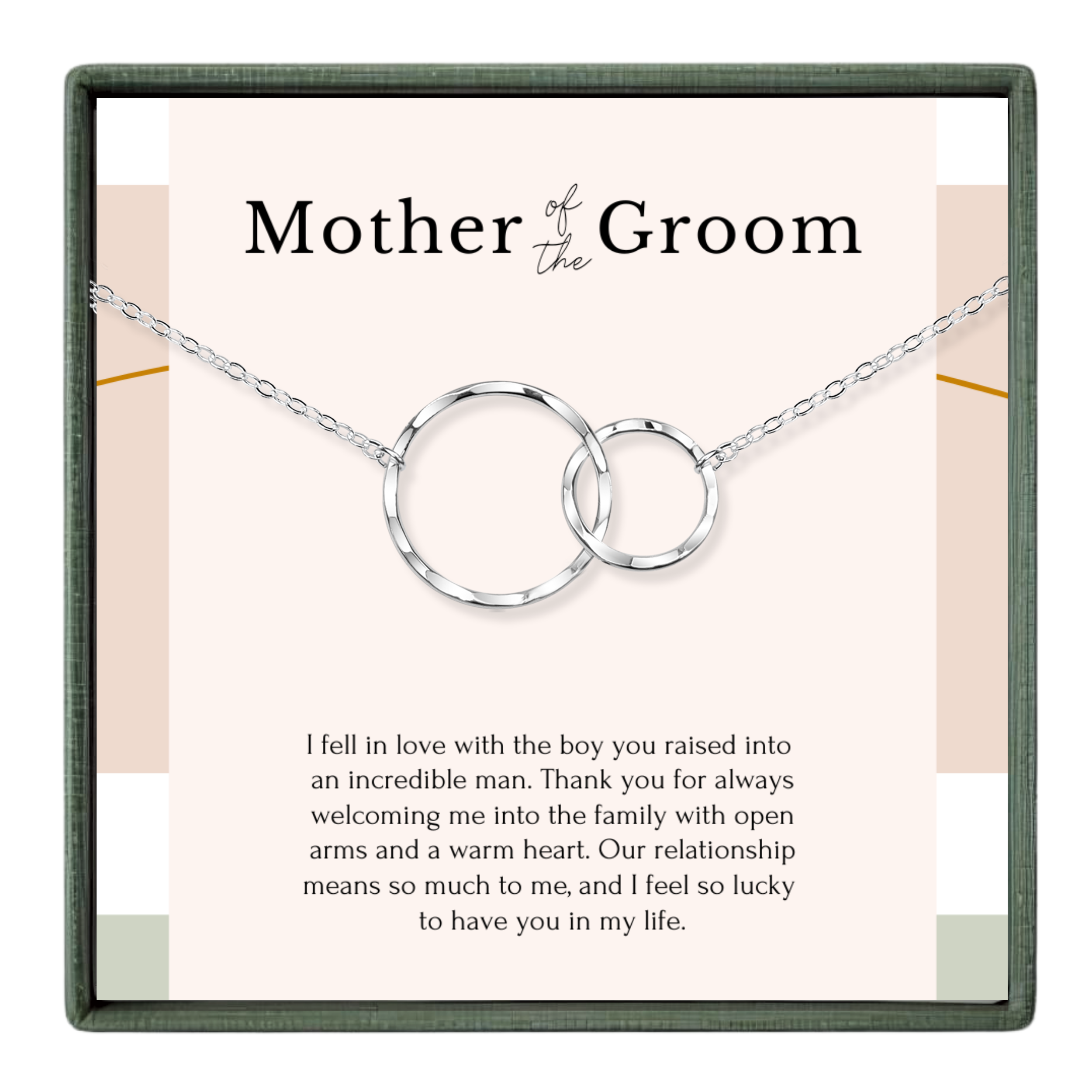 The image is a necklace with two interlocking silver rings, and it is presented in a square frame with a pink background.