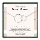 The image is a necklace with two interlocking silver rings, accompanied by a heartfelt message about the joys of motherhood.
