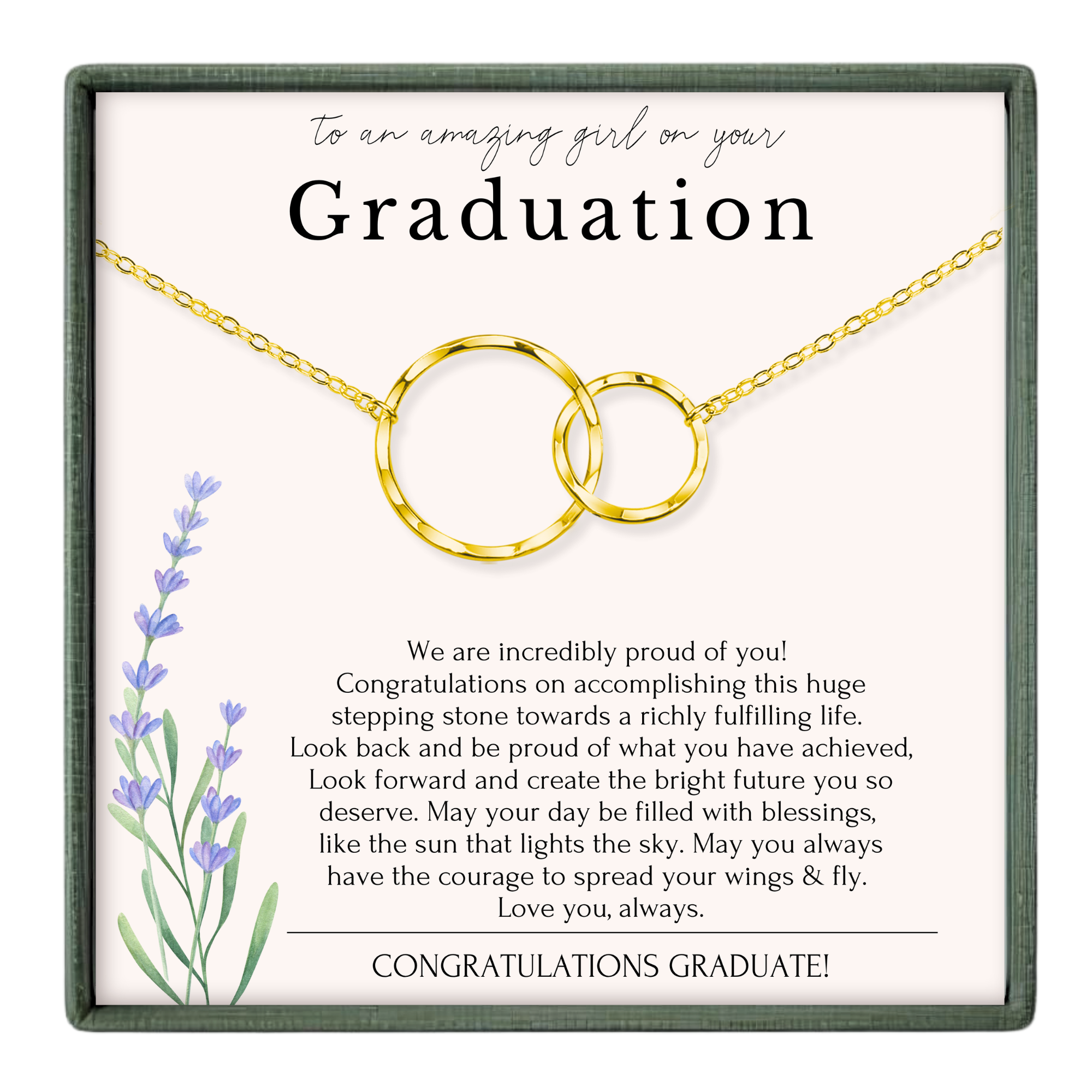 The image is a graduation gift box with a congratulatory message for a graduate. The box is framed in green and contains a gold chain with two circular pendants. The message congratulates the graduate on their achievements and wishes them a bright future.