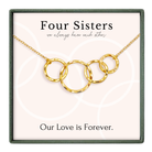 a necklace with a pendant that says "Four Sisters" and "Our Love is Forever."