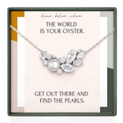a necklace with a large pearl pendant, accompanied by a motivational quote about achieving one's dreams and finding pearls.