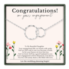 The image is a necklace with a message that congratulates someone on their engagement.