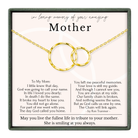 The image is a memorial box for a mother, containing a necklace with two gold rings and a heartfelt poem expressing love and remembrance.