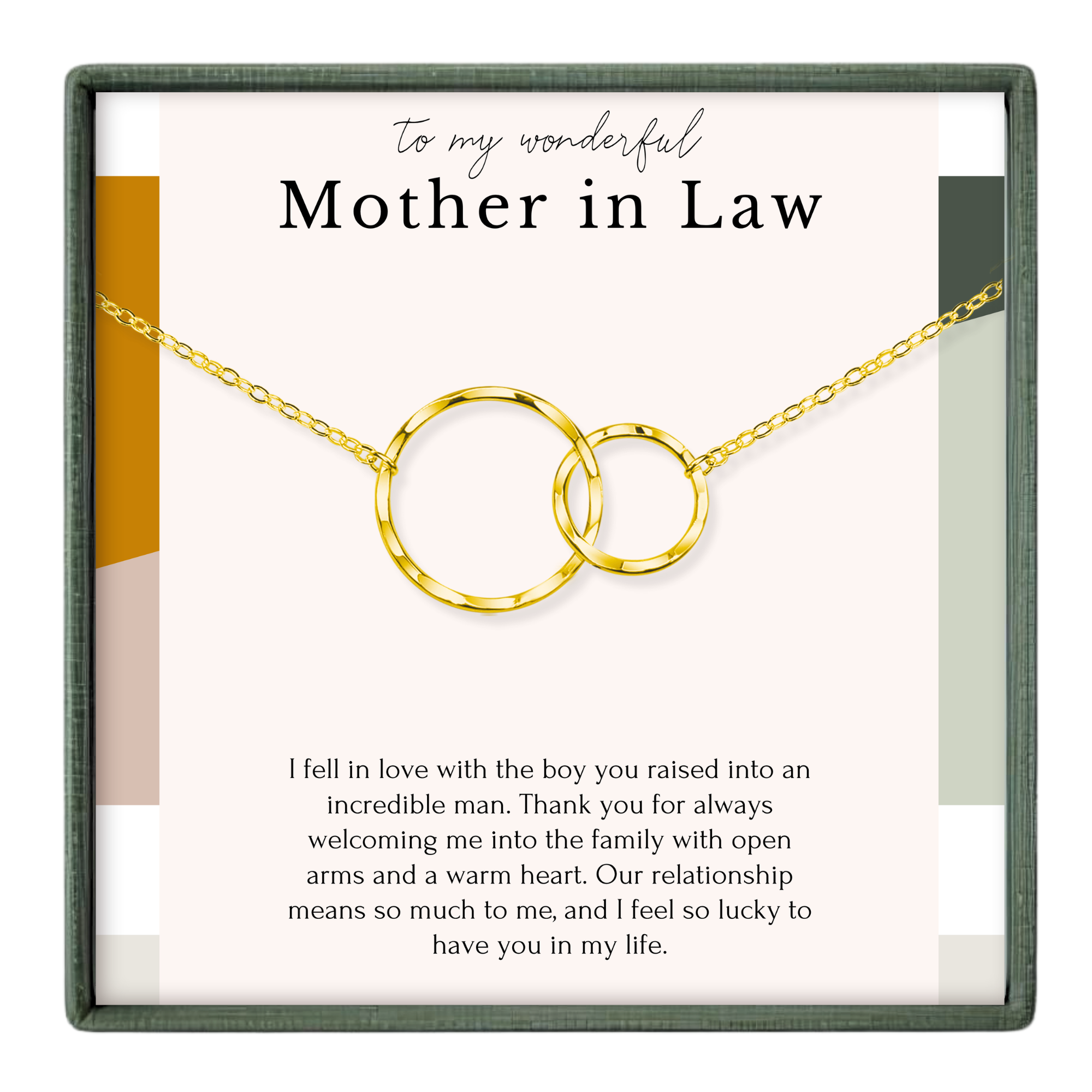 a necklace with two gold-colored circles, and there is a message written in black text on the necklace.