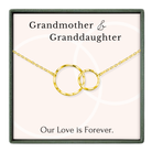 A necklace with two interlocking gold rings, accompanied by the text "Grandmother & Granddaughter" and "Our Love is Forever."