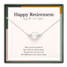 The image is a necklace with a pearl pendant, accompanied by a message that reads "Happy Retirement, enjoy the next chapter."