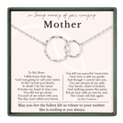 The image is a memorial box for a mother, containing a necklace with two interlocking rings and a heartfelt poem expressing love and remembrance.