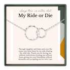 The image is a necklace with two interlocking silver rings, accompanied by a heartfelt message about friendship and love.