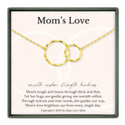 a necklace with two interlocking gold rings, accompanied by a heartfelt message about the love and strength of a mother.