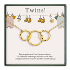 The image is a gift box with a necklace and a message about the arrival of a new baby.