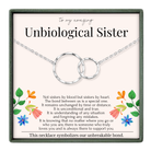 The image is a necklace box with a message about an Unbiological Sister, accompanied by a floral design on the left side.